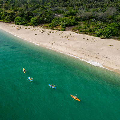 AKA-Kayakers-Along-Beach